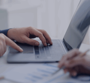 Person working at a computer laptop